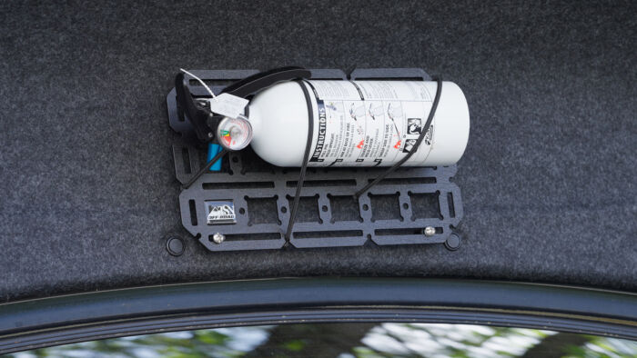 Fire Extinguisher on Molle panel in car trunk